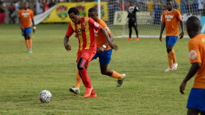 Jourdaine Fletcher of Cornwall College under pressure from the Lennon defence