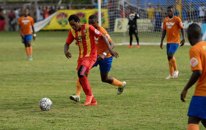 Jourdaine Fletcher of Cornwall College under pressure from the Lennon defence