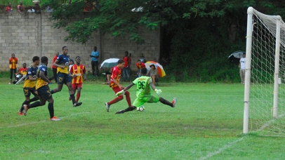 Cornwall College scoring one of their three goals against Munro