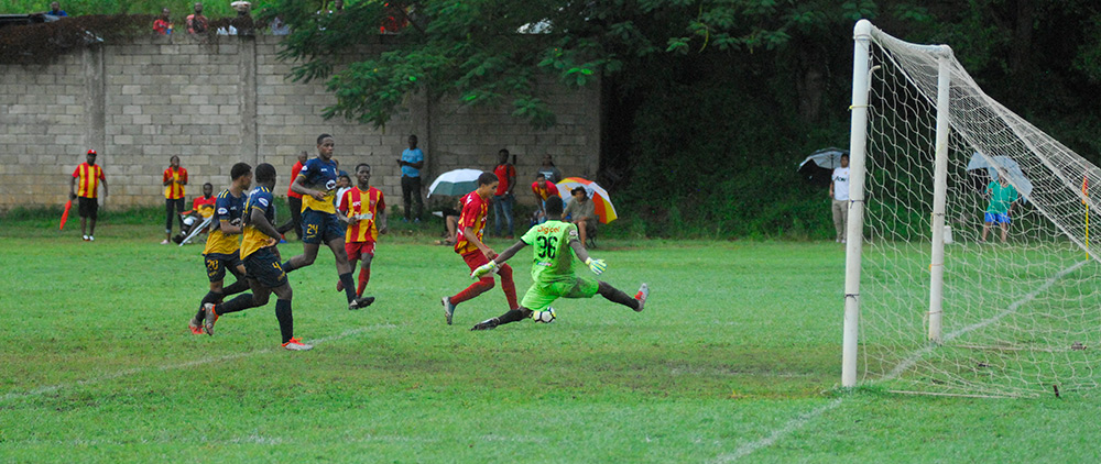 Cornwall College scoring one of their three goals against Munro